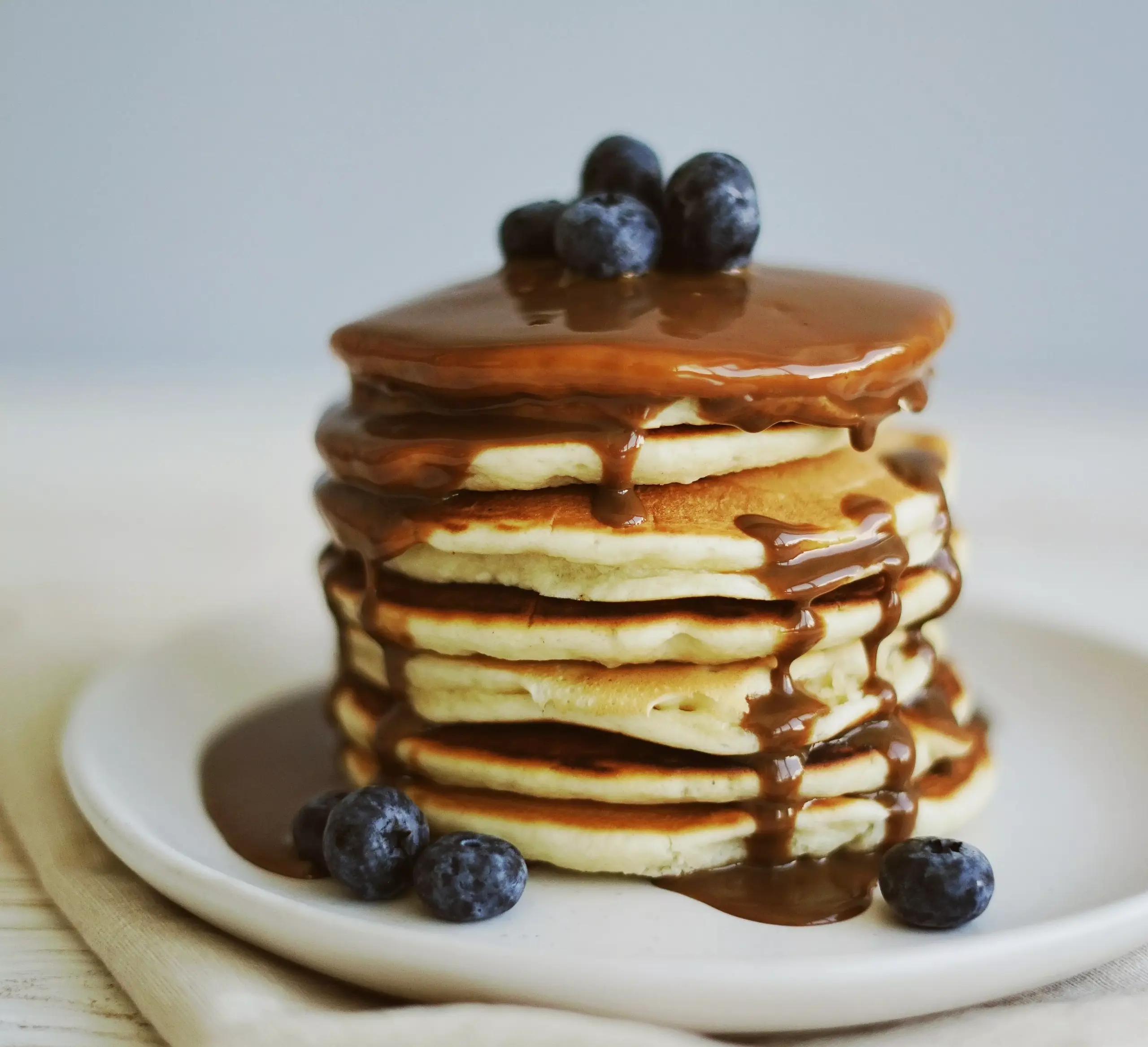 Illustration – Stack of Blueberry Pancakes in a kitchen